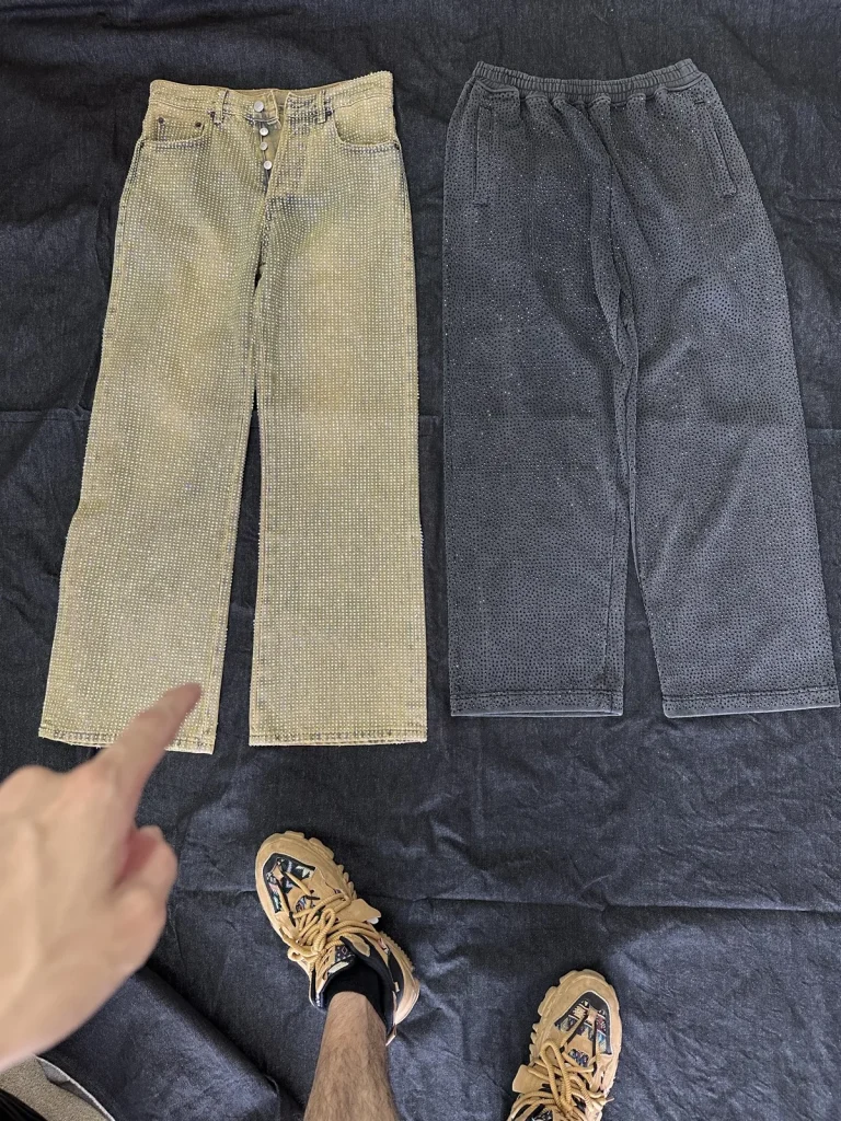Two photographed trousers in warm beige and washed dark grey.