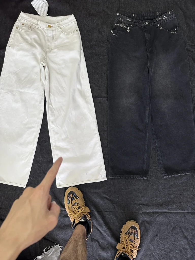 Off-white and dark trousers photographed side by side.
