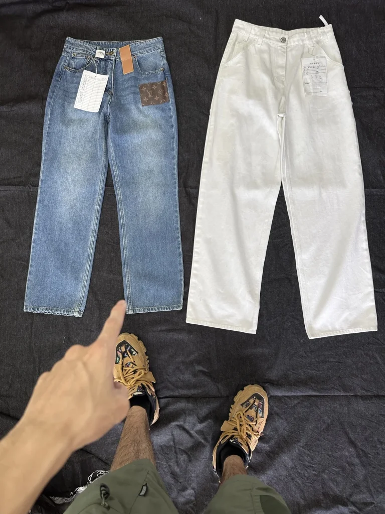 Indigo and off-white trousers with contrasting detail placement.